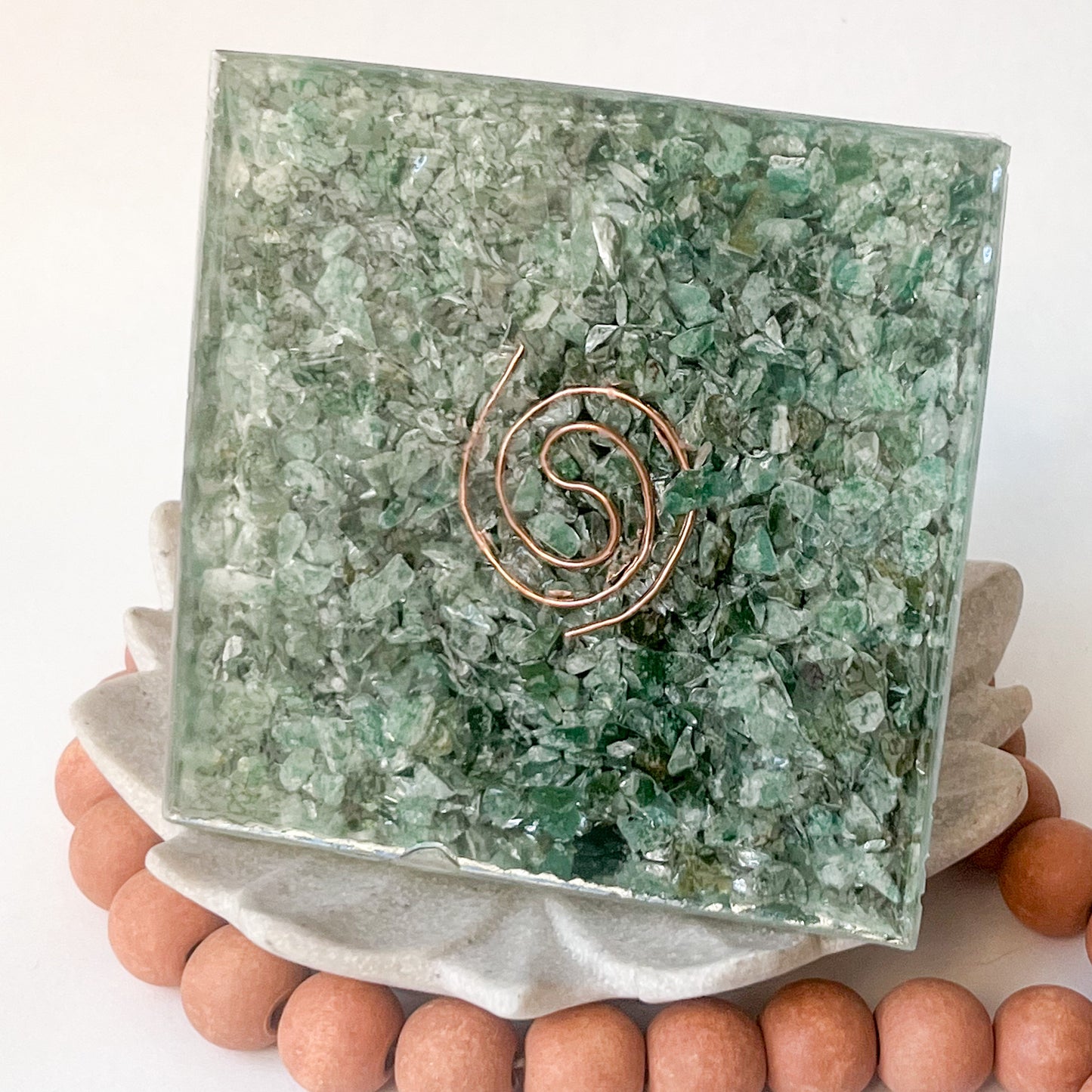 "Handmade orgonite pyramid with natural crystals for positive energy and EMF protection - bottom view