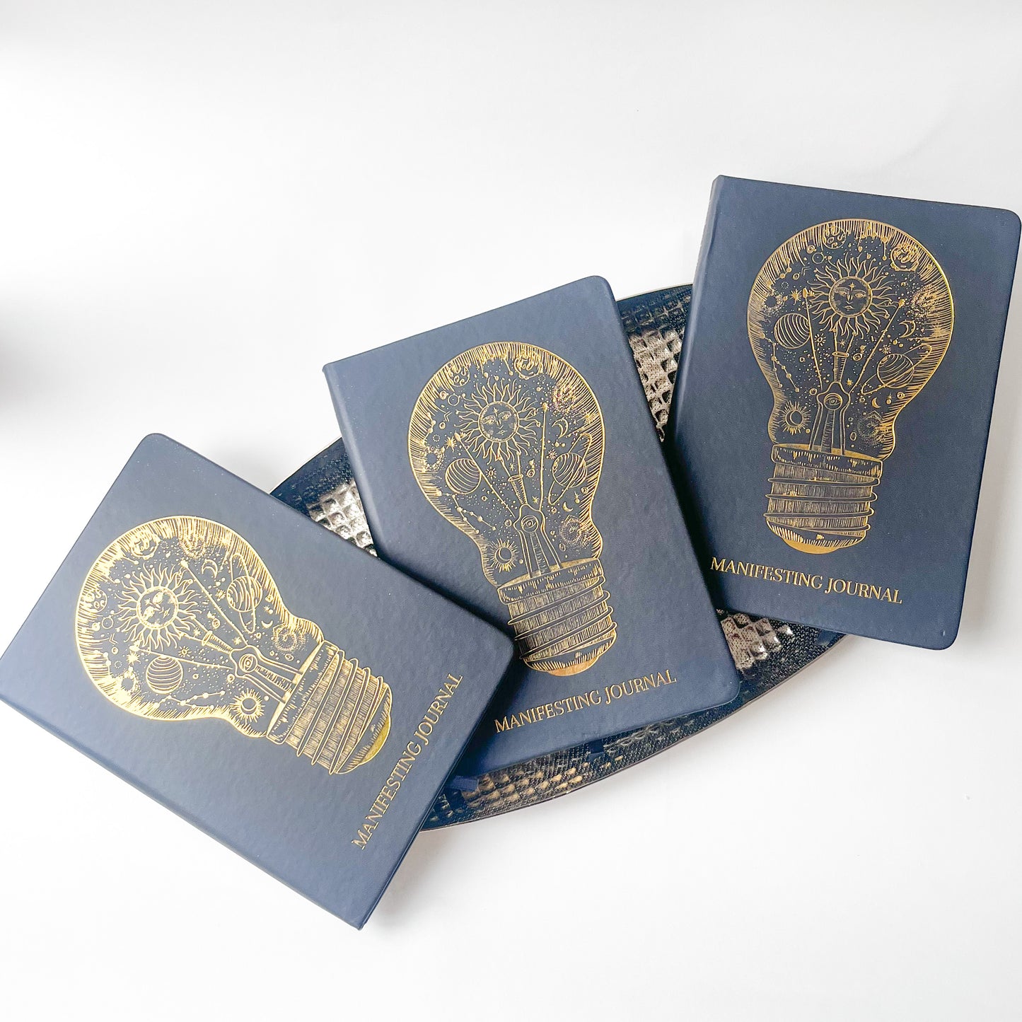 3 books - Leather Hardcover Manifesting Journal with image of lightbulb in gold foiling