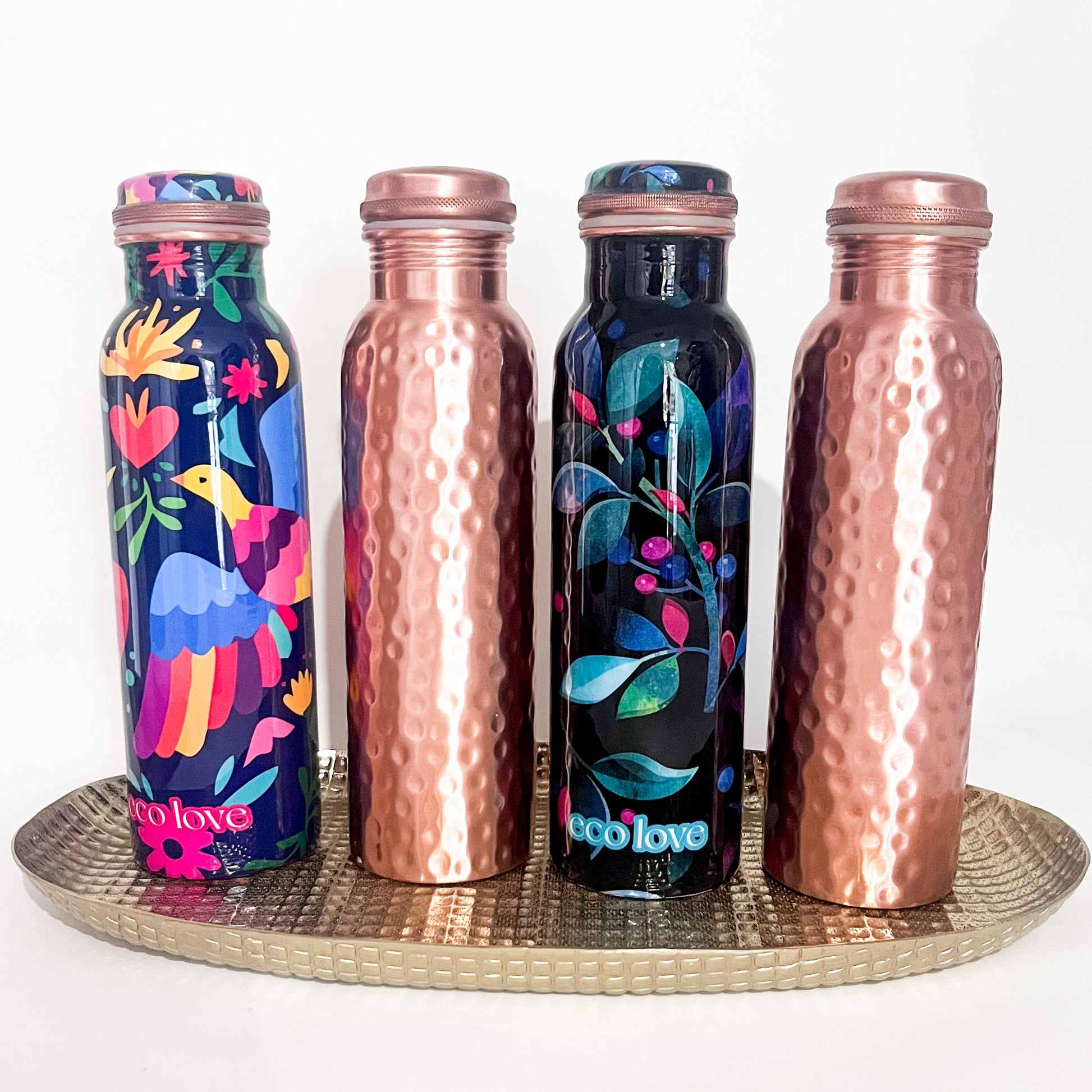 Image of Copper 1L bottles on gold tray
