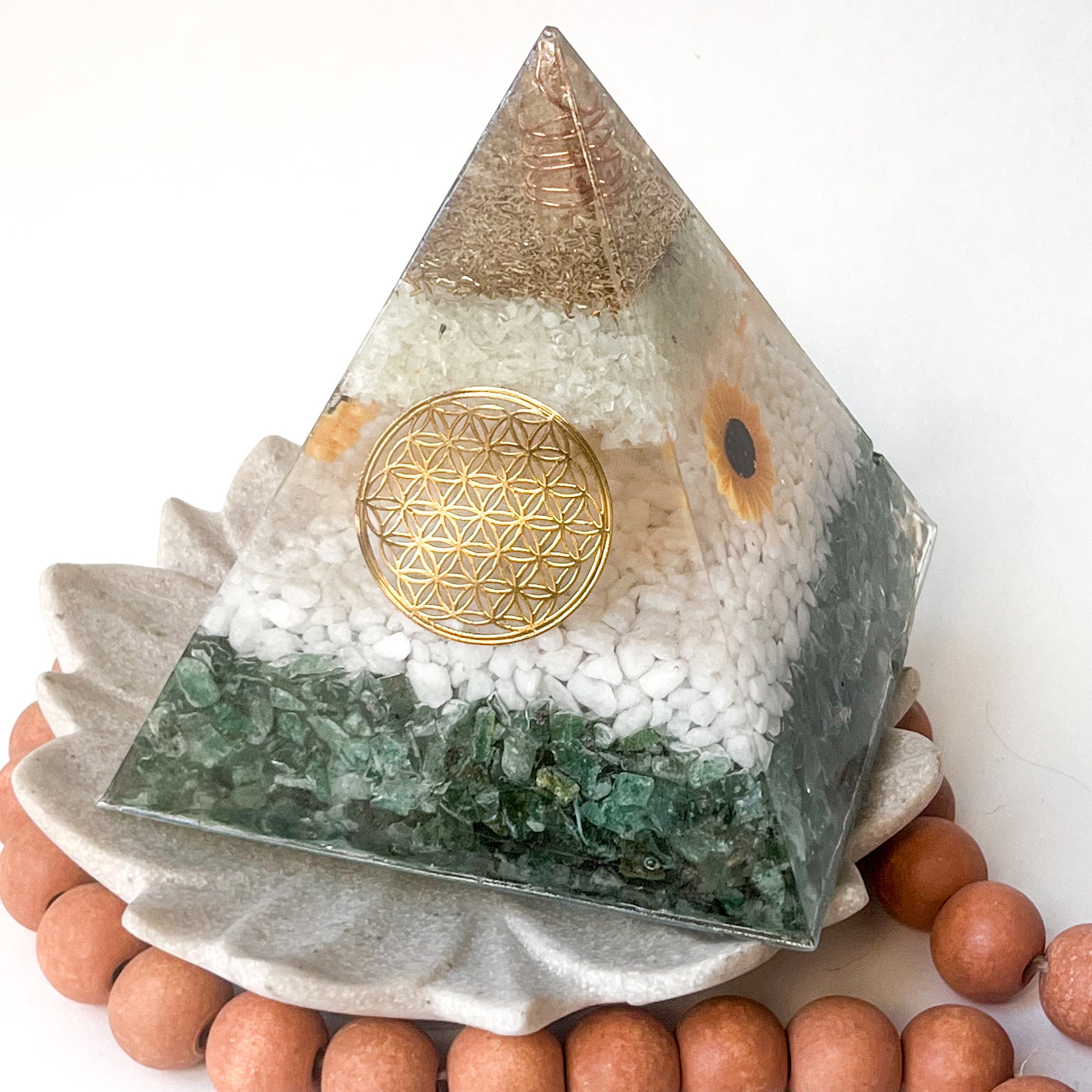 Colorful orgonite pyramid with sacred geometry design for spiritual growth and harmony