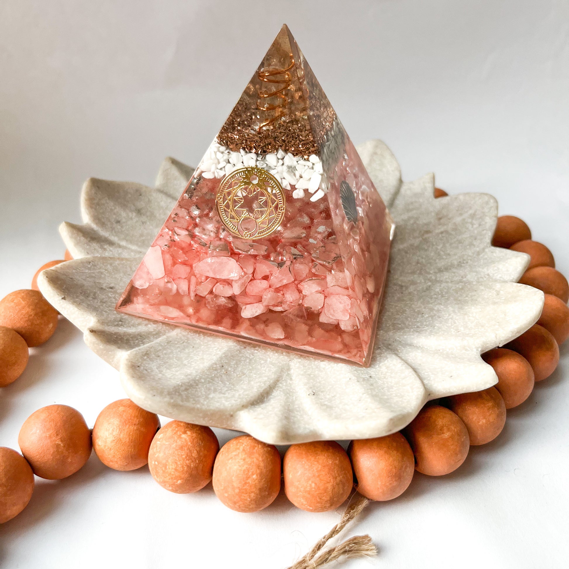 small 7.5cm orgonite pyramid with rose quartz and howlite crystals